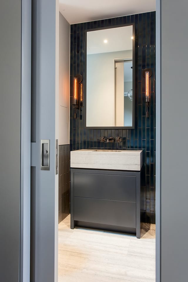 powder Room with dark blue tiles