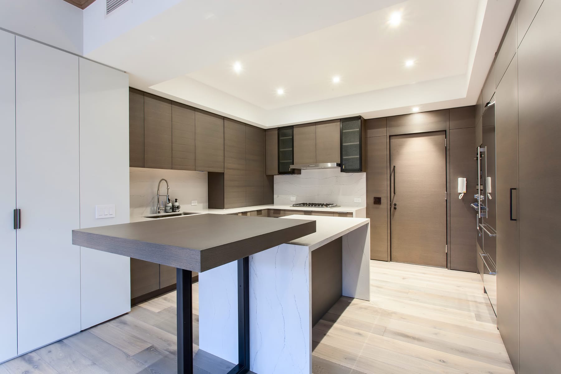 kitchen cabinetry with stone countertops and island