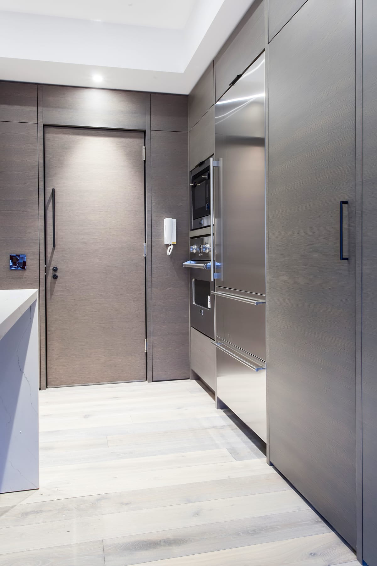 kitchen cabinetry with stone countertops and island