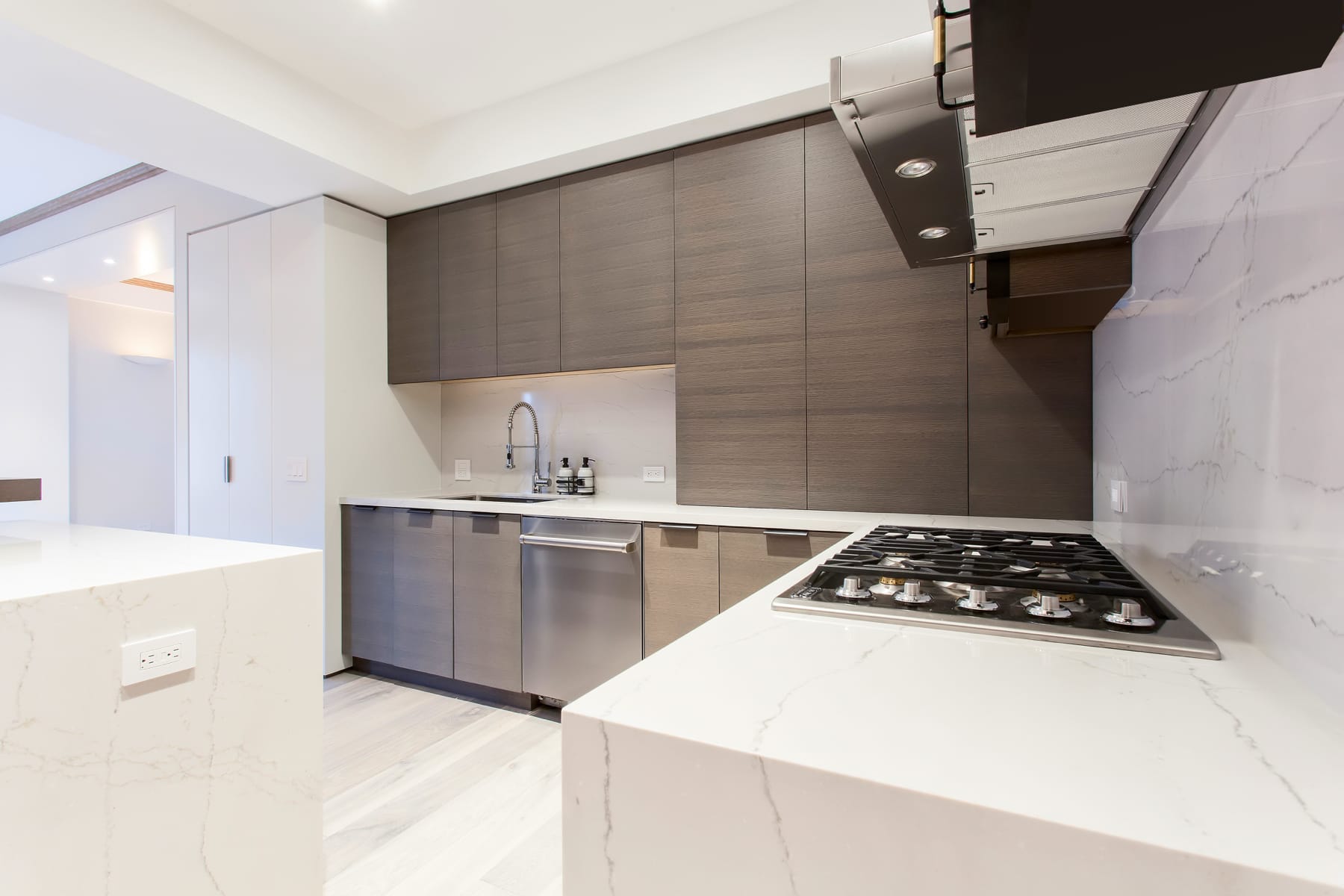 kitchen cabinetry with stone countertops and island