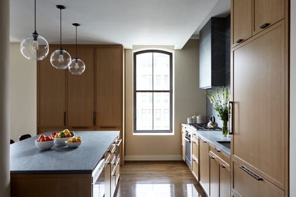Kitchen with island and stone backsplash