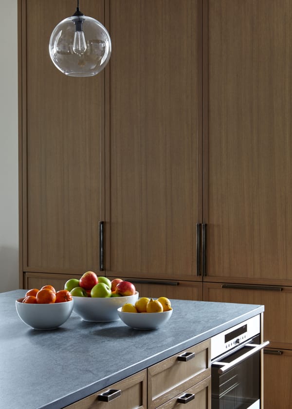 Kitchen with island and stone backsplash